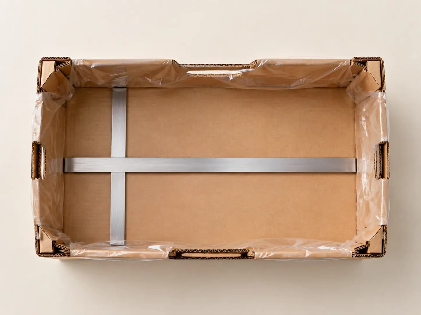 AI packaging illustration: plain empty rectangular kraft carton shown strictly from above with two blank metal straightedges laid along its inner length and inner width