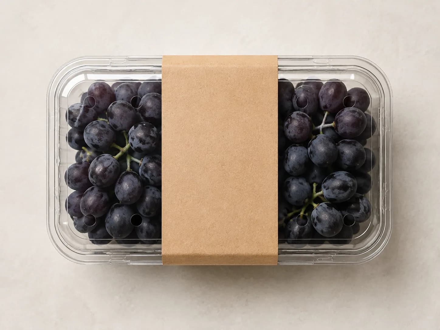 AI packaging illustration: one closed rectangular grape punnet on a neutral surface shown strictly from above with a blank straightedge along its longest outer lid edge