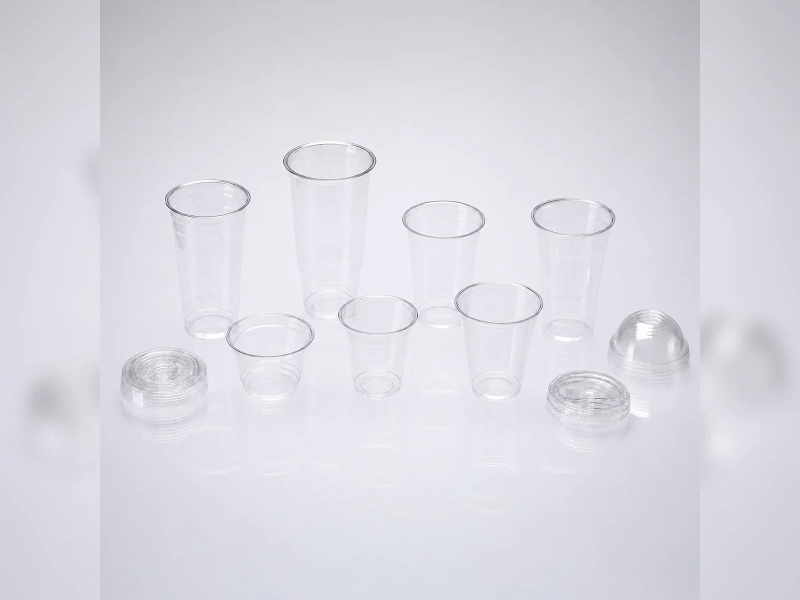 A supplied comparison view with visible clear cup and lid forms.