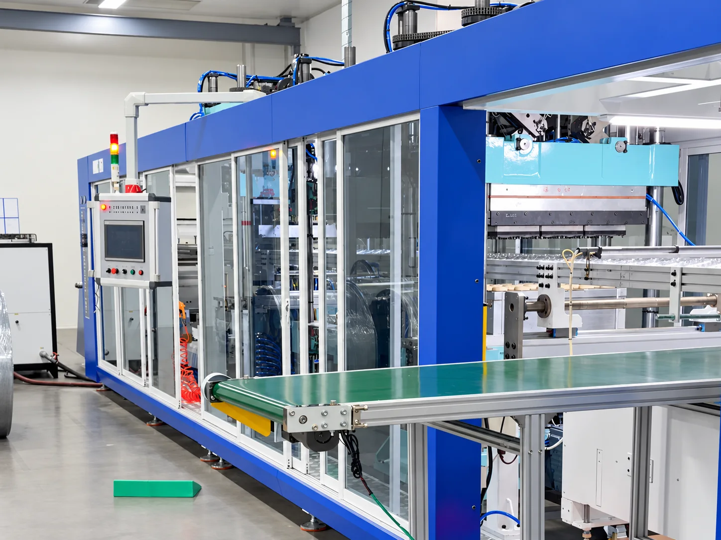 Blue forming equipment on the factory floor