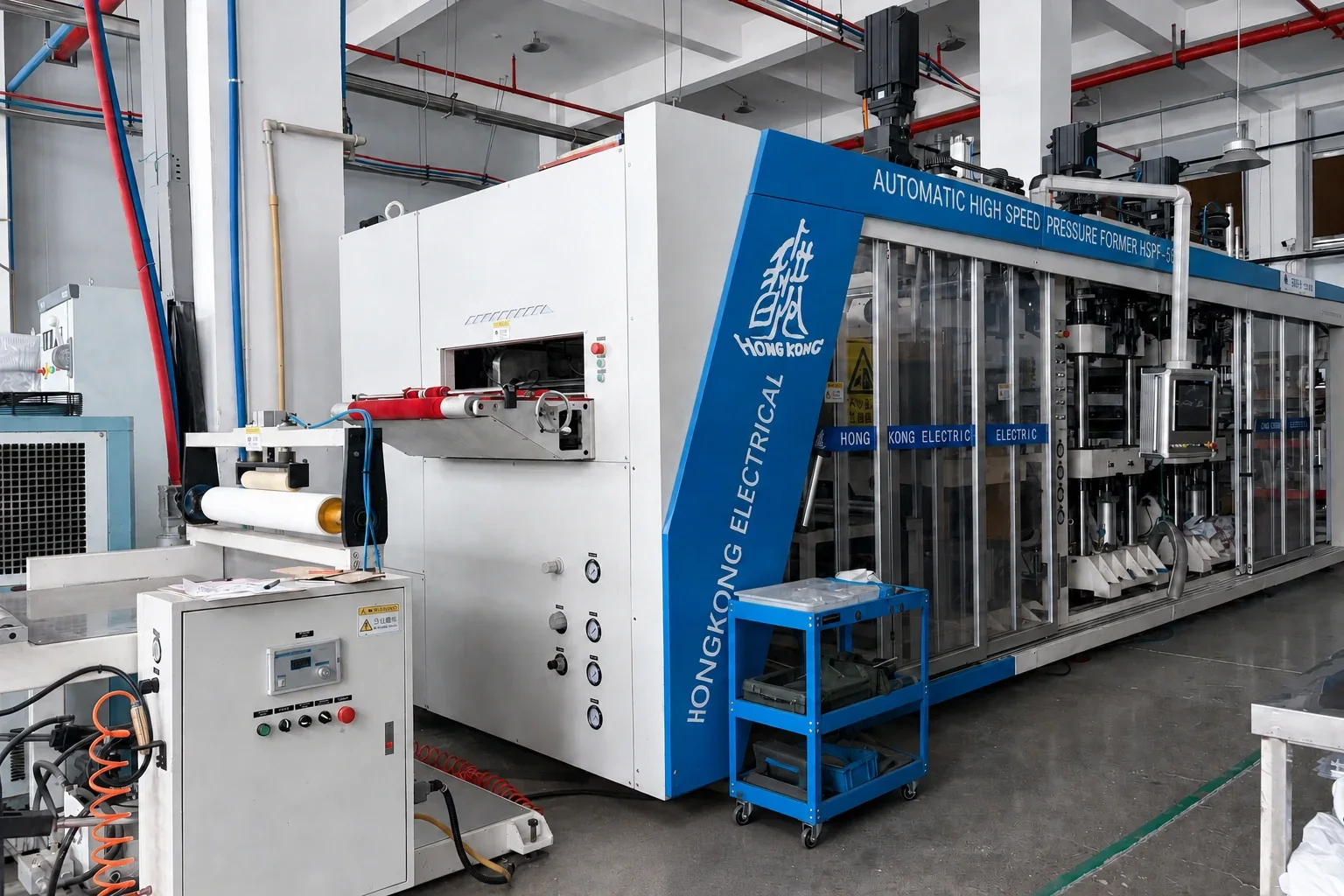 Forming machine viewed from its sheet-feed and control side