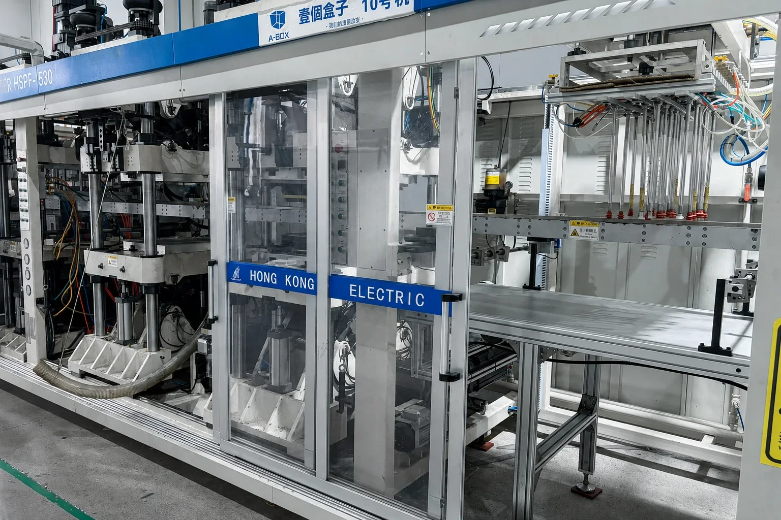 Close view of the handling arms inside the forming equipment