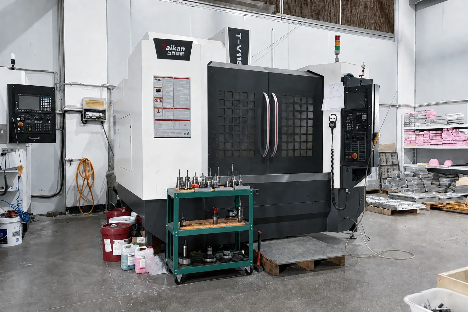 Machining centre beside tooling material in the preparation area