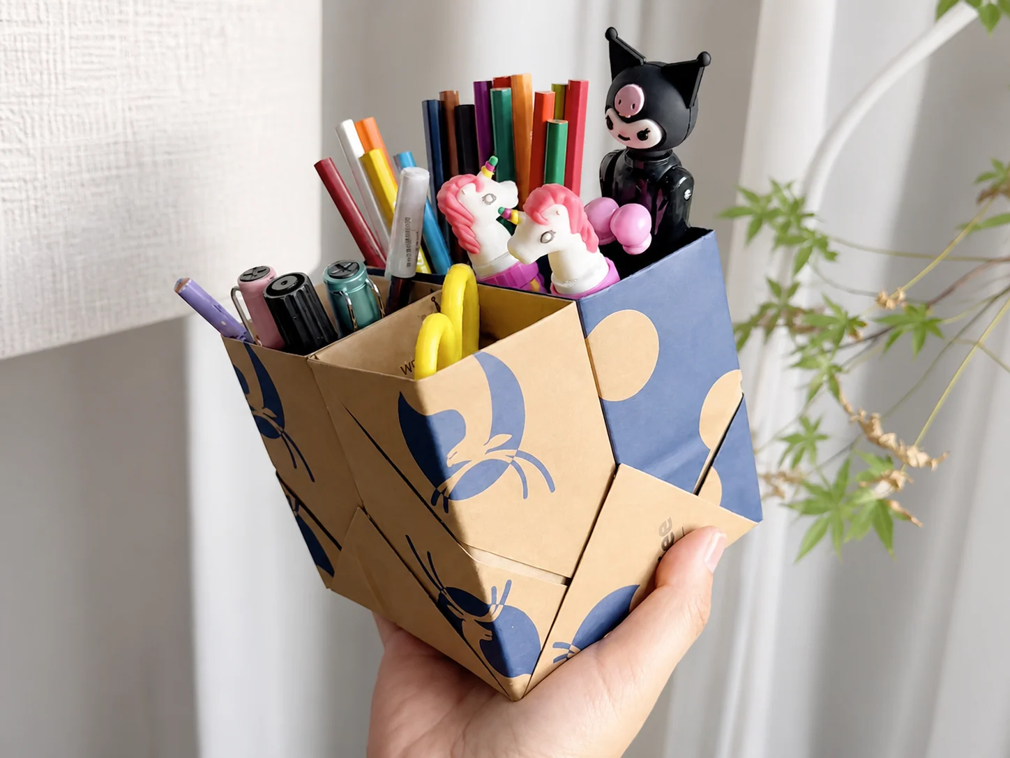 Fold lines and internal panels can convert a carton into a multi-compartment desktop organizer.